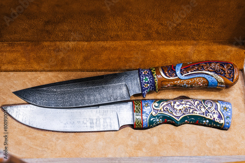 two traditional oriental Uzbek chust knives made of Damascus steel in a wooden gift box in Uzbekistan in Tashkent