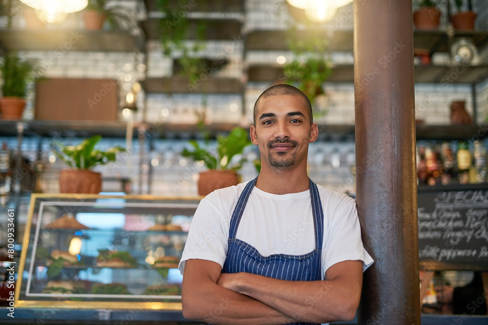 © peopleimages.com - Portrait, business and Brazilian man at cafe with confidence in startup, growth and ownership. Coffee shop, waiter and smile or satisfied with restaurant progress and investment as entrepreneur