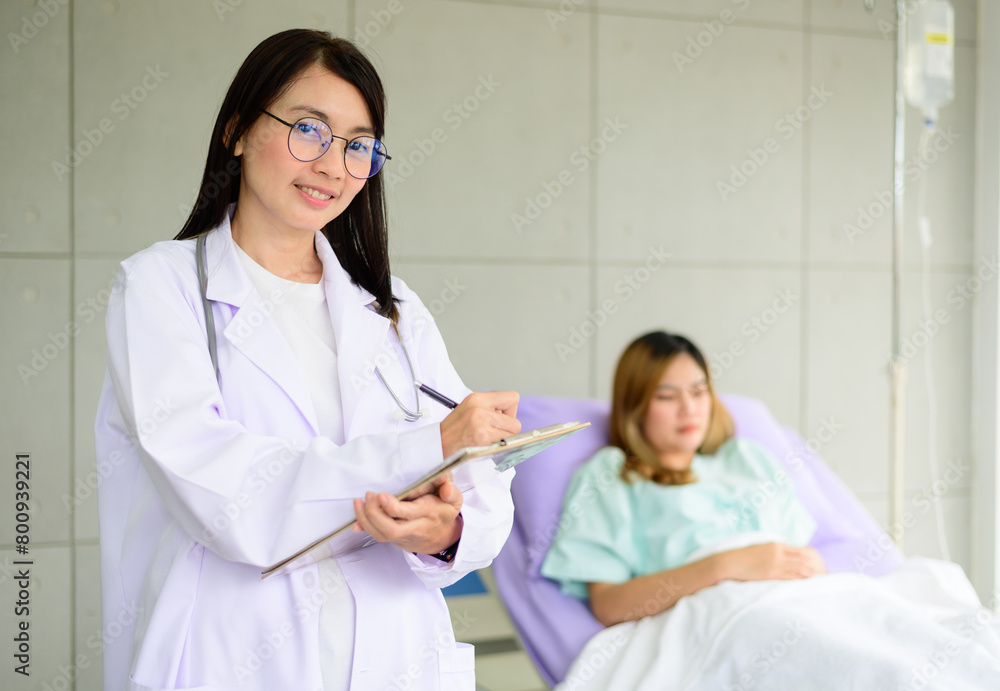 Asian female doctor hand taking note information of patient lying on bed Asian female doctor hand taking note information of patient lying on bed