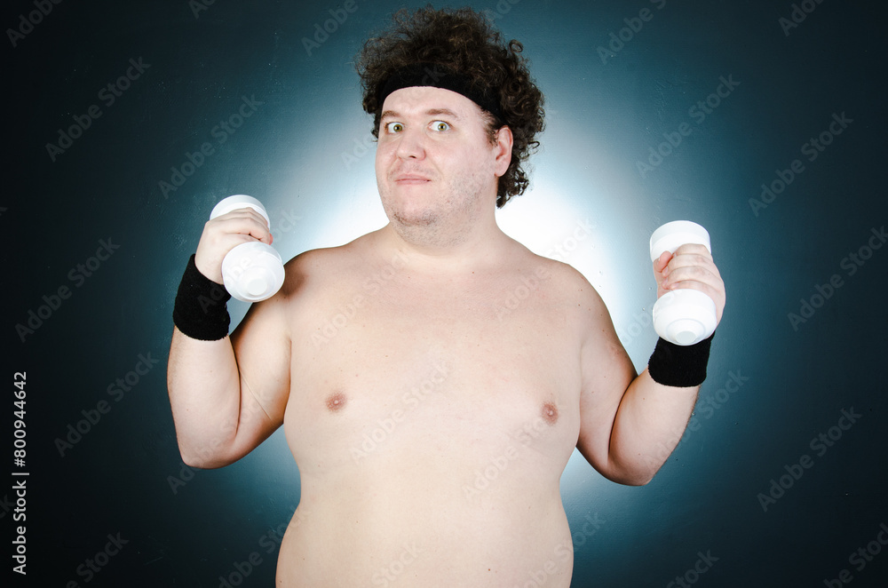 Fototapeta premium Funny fat man doing sports. Healthy lifestyle.