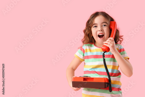 Shocked little girl with re...
