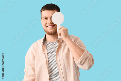 Young man with eye occluder...