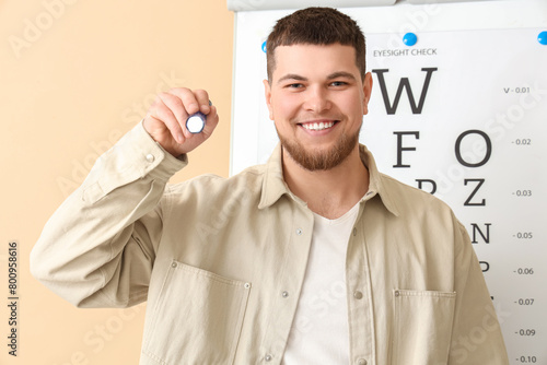Young man with flashlight a...