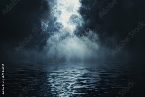 Ethereal clouds and mist  resembling the divine presence  hover above dark  still water.  Black and white 
