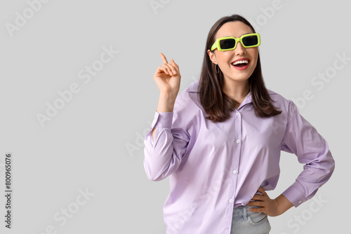 Smiling young woman in sung...