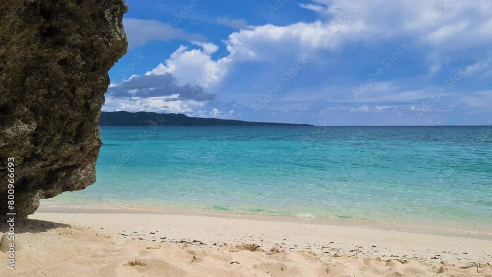 Tropical Paradise, White Sand Beach, Turquoise Sea and Rock Static Shot 60fps Tropical Paradise, White Sand Beach, Turquoise Sea and Rock Static Shot 60fps
