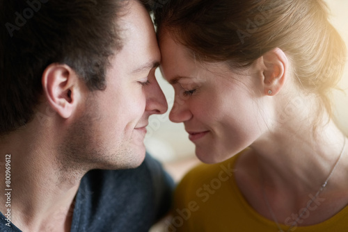 Face, love or smile and couple closeup in home for bonding, romance or togetherness with flare. Connection, date or happy with forehead touch of man and woman in apartment for support or trust © peopleimages.com
