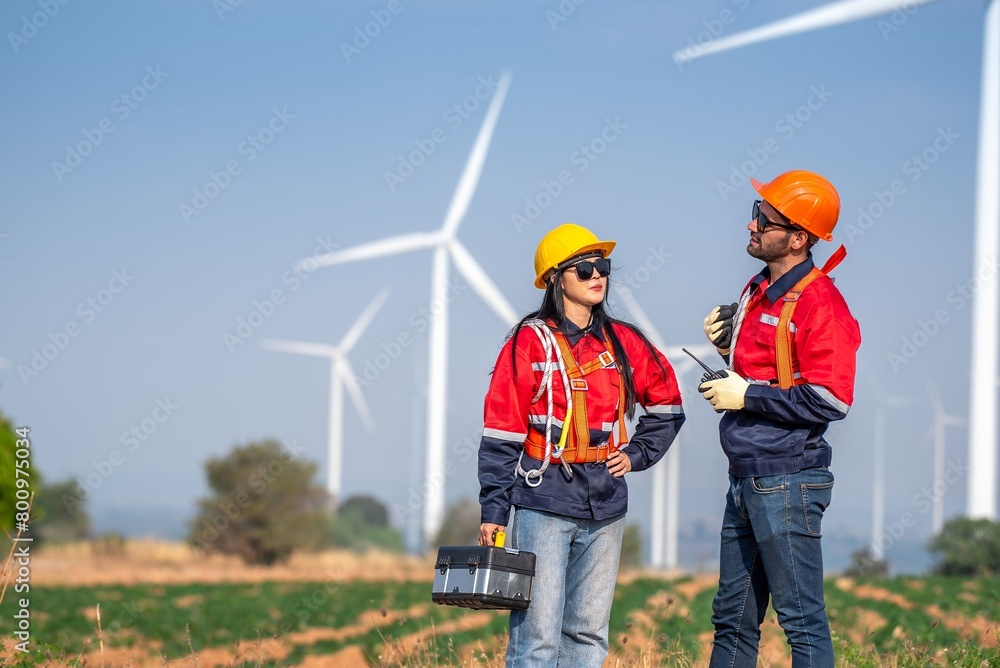 couple engineer team inspection check control wind power machine construction installation in wind energy factory. Two technician professional worker discussion for maintenance wind power turbine couple engineer team inspection check control wind power machine construction installation in wind energy factory. Two technician professional worker discussion for maintenance wind power turbine