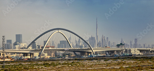 Dubai skyline of infinite bridge and burj khalifa photo