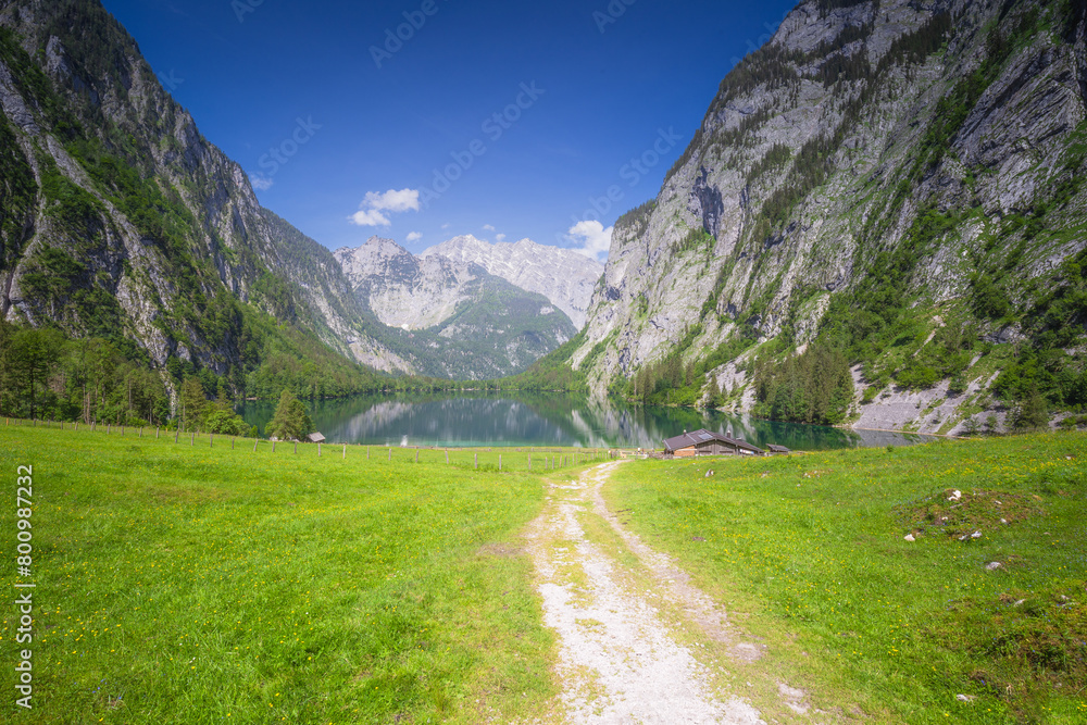 Mountain valley with tracks near Obersee lake in Berchtesgaden National Park Mountain valley with tracks near Obersee lake in Berchtesgaden National Park