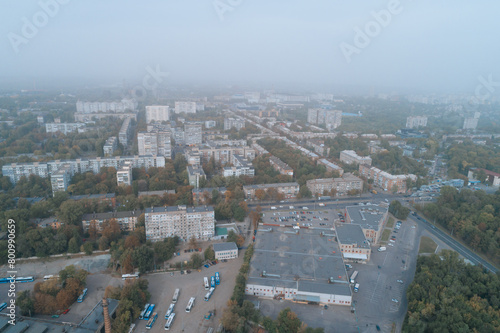 Aerial view of Dnipto city, Ukraine in fog. Cityscape. Panoramic view. Foggy metropolis. Ghost town. Atmospheric shot. © Denis Chubchenko