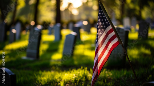 A flag is on a grassy field next to a cemetery