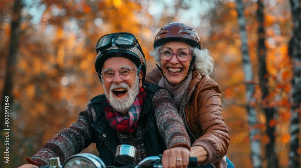 A man and a woman are smiling and riding a motorcycle together A man and a woman are smiling and riding a motorcycle together