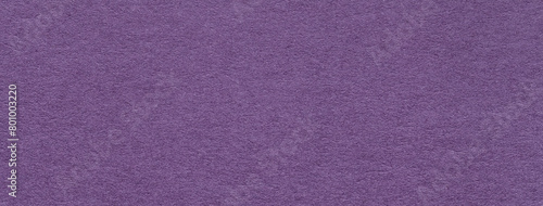 Texture of craft old dark purple color paper background , macro. Vintage kraft violet cardboard.