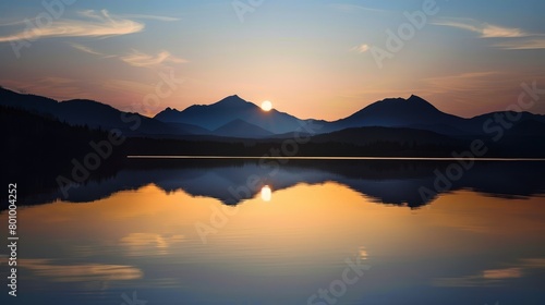 Wallpaper Mural A serene lake that perfectly reflects a rare solar eclipse, surrounded by silhouetted mountains. Torontodigital.ca