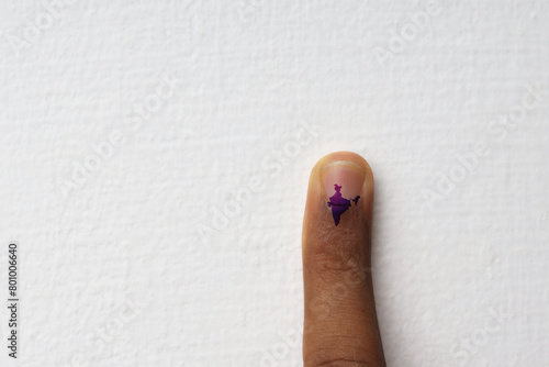 A finger with an electoral stain in the shape of India. Concept of election in India