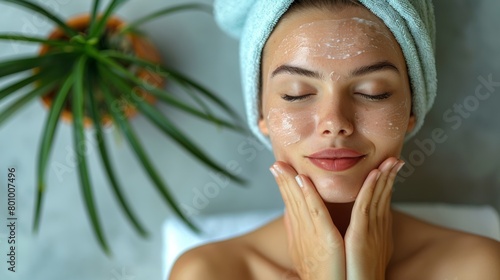 A serene woman enjoying a relaxing facial massage, relieving tension and promoting glowing skin with self-care.