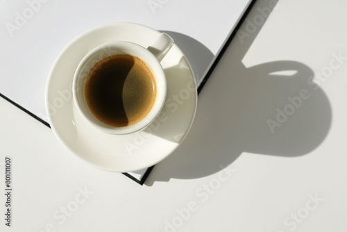 Workplace Still Life with Cup of Coffee and Open Notebook. Coffee Break.    