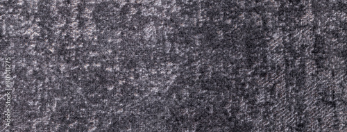 Texture of velvet dark gray and silver background from soft upholstery textile material, macro.