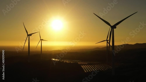 Top view of Wind Turbine Power Generators At Sea Coastline at sunset. Alternative Renewable Energy . Philippines.