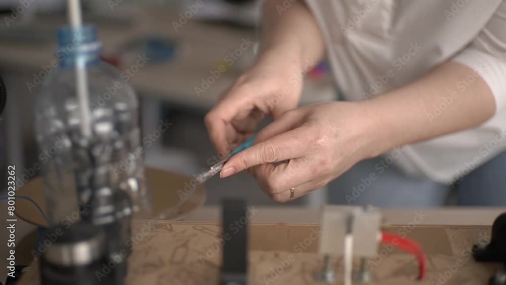 use scissors.woman and plastic recycling. processed products. slow motion video. High-quality 4K shooting use scissors.woman and plastic recycling. processed products. slow motion video. High-quality 4K shooting
