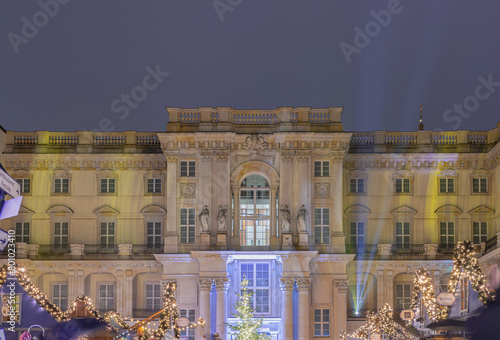 The Festive illumination of the palace facade at night. A Christmas market held in large courtyard of the restored Berlin Palace (Berliner Schloss) also known as Humboldt Forum Located on Schlossplatz photo
