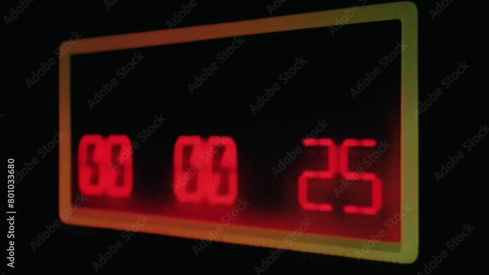 Real TV capture: a shaky countdown timer, red LCD numbers going down to zero on a big display. Concepts: danger, deadline, terrorism; or the new year coming. Real TV capture: a shaky countdown timer, red LCD numbers going down to zero on a big display. Concepts: danger, deadline, terrorism; or the new year coming.