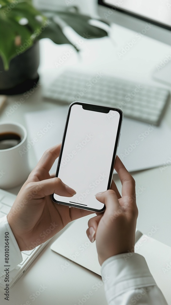 A Vertical Image Of A Person Holds A Smartphone With A White Screen. A Vertical Image Of A Person Holds A Smartphone With A White Screen.