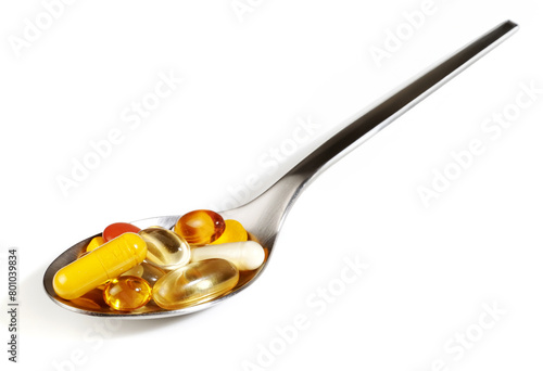 Pills on a spoon on white background - Panorama