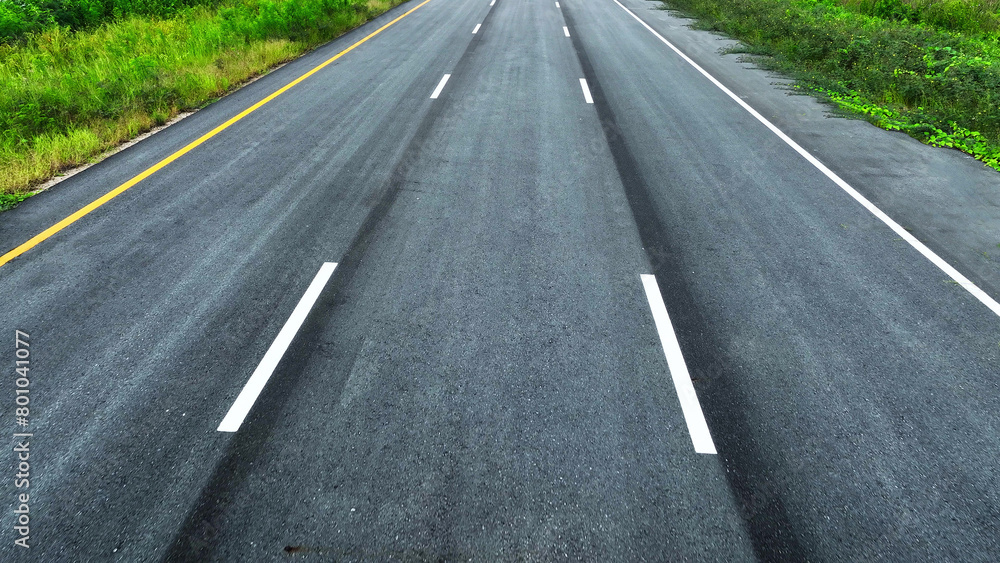 Aerial drone view : The epic intercity motorway stretches out like a ribbon of perfection, its asphalt surface gleaming, untouched by vehicles, offering a serene perspective from the heavens.
Aerial drone view : The epic intercity motorway stretches out like a ribbon of perfection, its asphalt surface gleaming, untouched by vehicles, offering a serene perspective from the heavens.