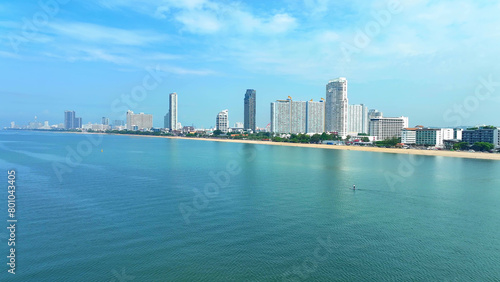 Jomtien Beach  bathed in sunlight and fringed by vibrant flora  epitomizes coastal sophistication. From above  it unveils a stunning blend of nature and leisure. Pattaya  Thailand. Nature concept. 