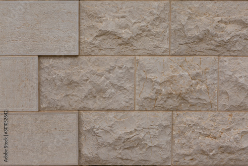 Fragment of wall cladding with marble slabs