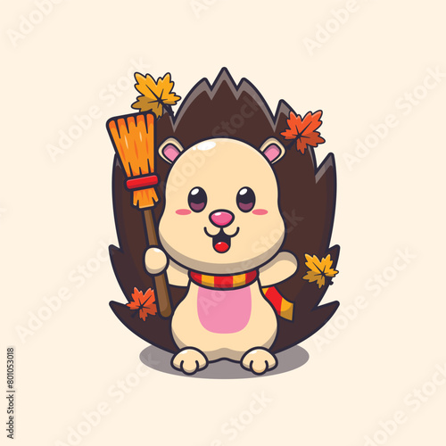 Cute autumn hedgehog holding broom