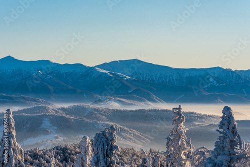 Velky Krivan and Maly Krivan from Velka Raca hill in Kysucke Beskydy mountains during beautiful winter day photo
