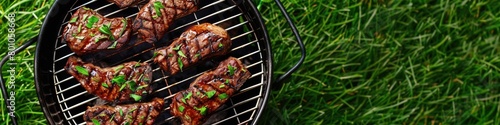 Top View of Delicious Grilled Steak on Kettle Grill in the Yard: Perfect for Spring and Summer