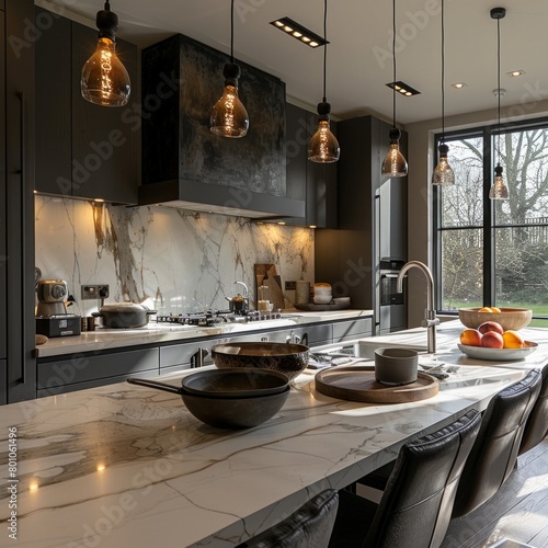 A modern kitchen with a marble countertop and black cabinets © tope007
