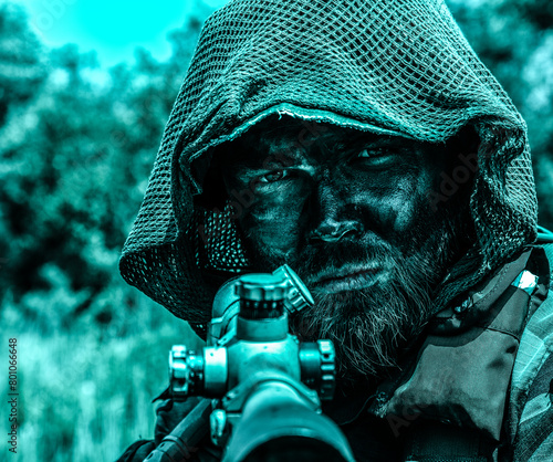 A camouflaged soldier with a piercing gaze, in tactical gear, keeps watch, in the jungle forest swamp. Close up portrait with rifle. 
