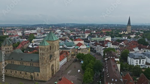 Aerial drone view of Osnabrück's Innenstadt in Germany. The old town center is known for its colorful gabled houses and centuries-old buildings.  photo