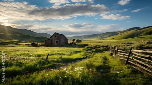 A country scene with a fence and a barn in the foreground photo