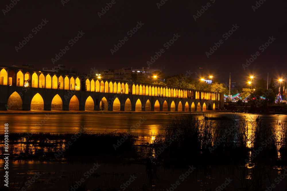 the beautiful view of the city of Isfahan and the zayandeh rud River at night and the thirty-three bridge (siose pol) of this city, which have a special view at night with lighting