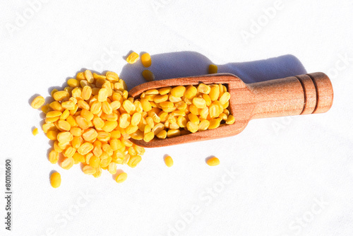 Traditional Indian deep-fried moong dal namkeen - The mung bean, alternatively known as the green gram, maash, or moon in spooon پیلی دال photo