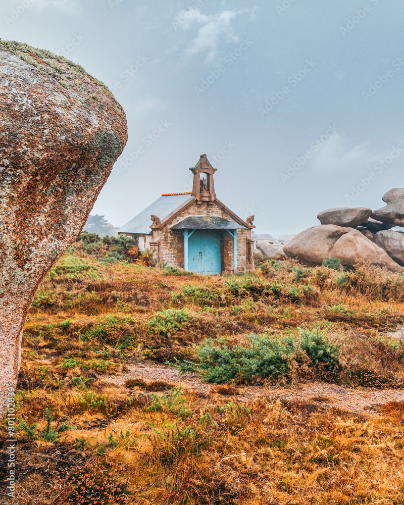 small chapel on the coast of french brittany. Chapel of St. Guirec, Sentier des Douaniers hiking trail, customs officers' trail, Ploumanach, Cote de Granit Rose, Brittany, France, Europe