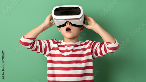 Young boy wearing virtual reality (VR) goggles. Light background. Copy space.