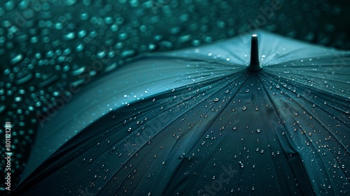 A close-up of a blue umbrella with glistening raindrops, symbolizing weather protection and rainfall.