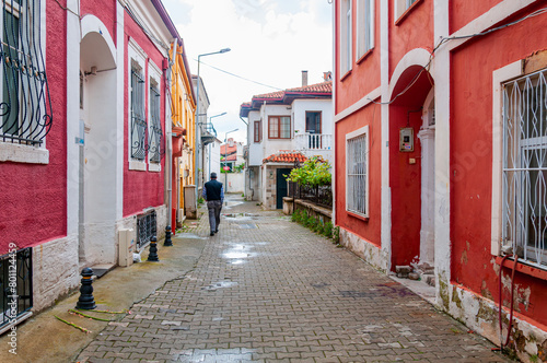 Man Walking on a Narrow Street in the Old City.