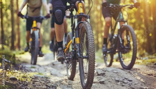 Group of cyclists enjoying a ride together on a scenic dirt path in a tranquil rural environment © Andrei