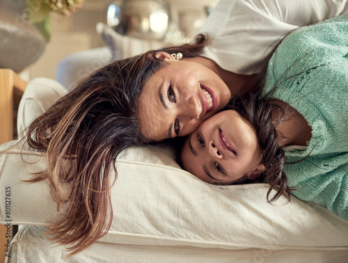 Mom, girl and playful in portrait on sofa with love for child development, support and care at home. Woman, kid and crazy in living room with smile for parenting, trust and gratitude on mothers day