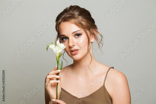 Nice young woman on white background © artmim