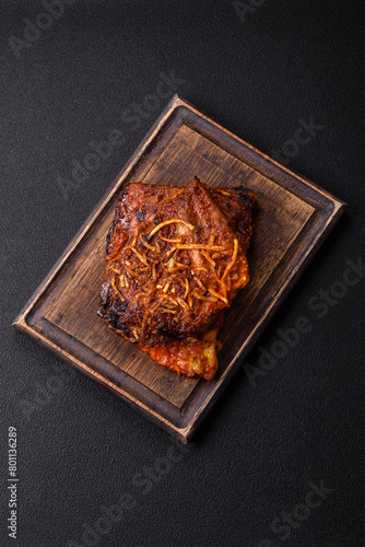Delicious pork or beef ribs baked on the grill with salt, spices and herbs