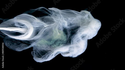 Swirling smoke creates captivating patterns under subtle lighting. (ID: 801138056)